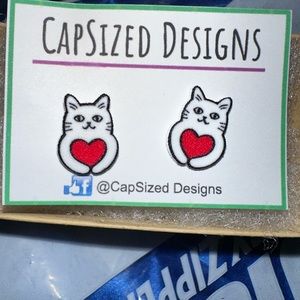 Brand new cat post earrings featuring a cat and a heart.